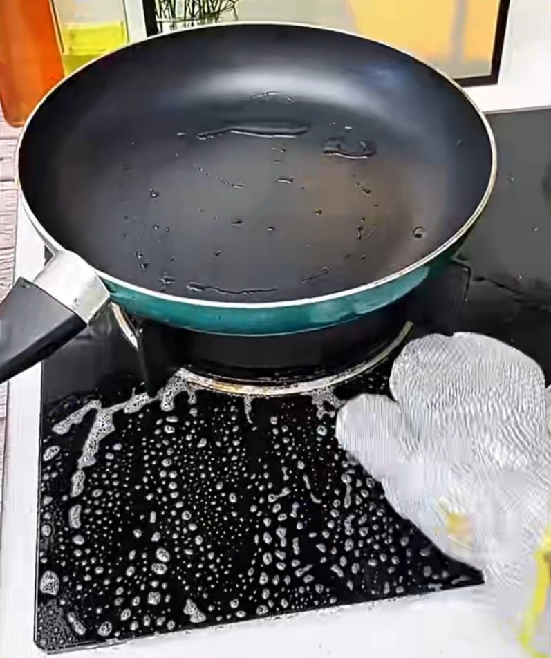 Close-up of gloves cleaning tough stains