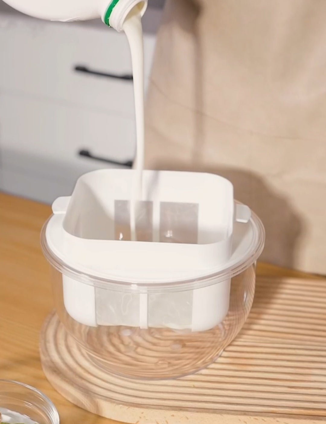 Pouring yogurt in the Strainer 