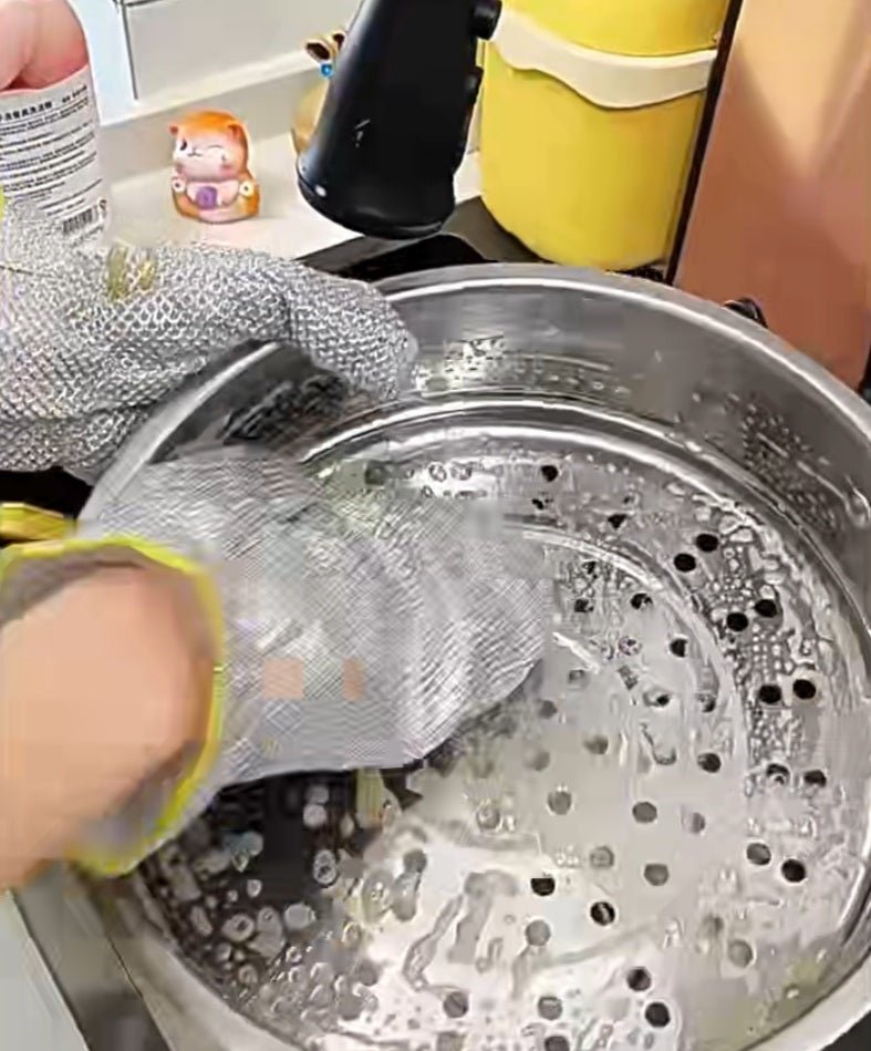 Close-up of gloves cleaning tough stains